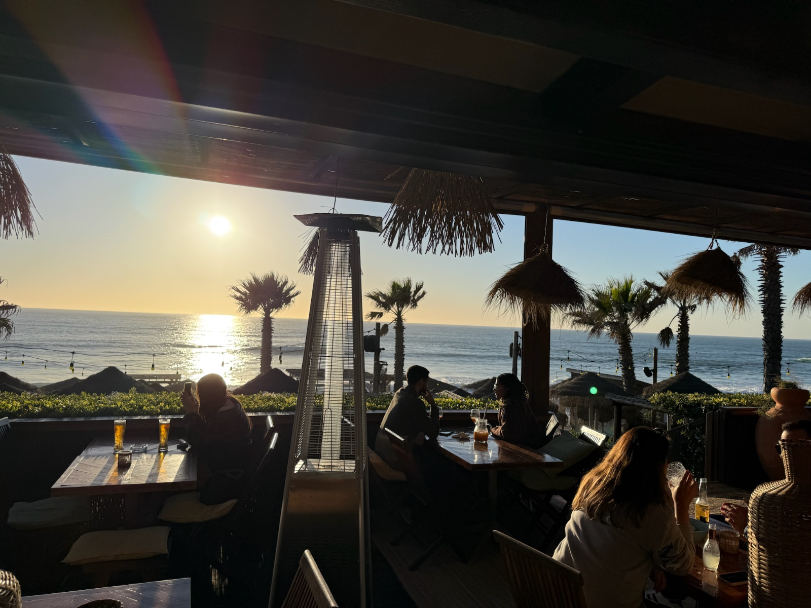 Beach bar terrace at sunset near Fonte da Telha