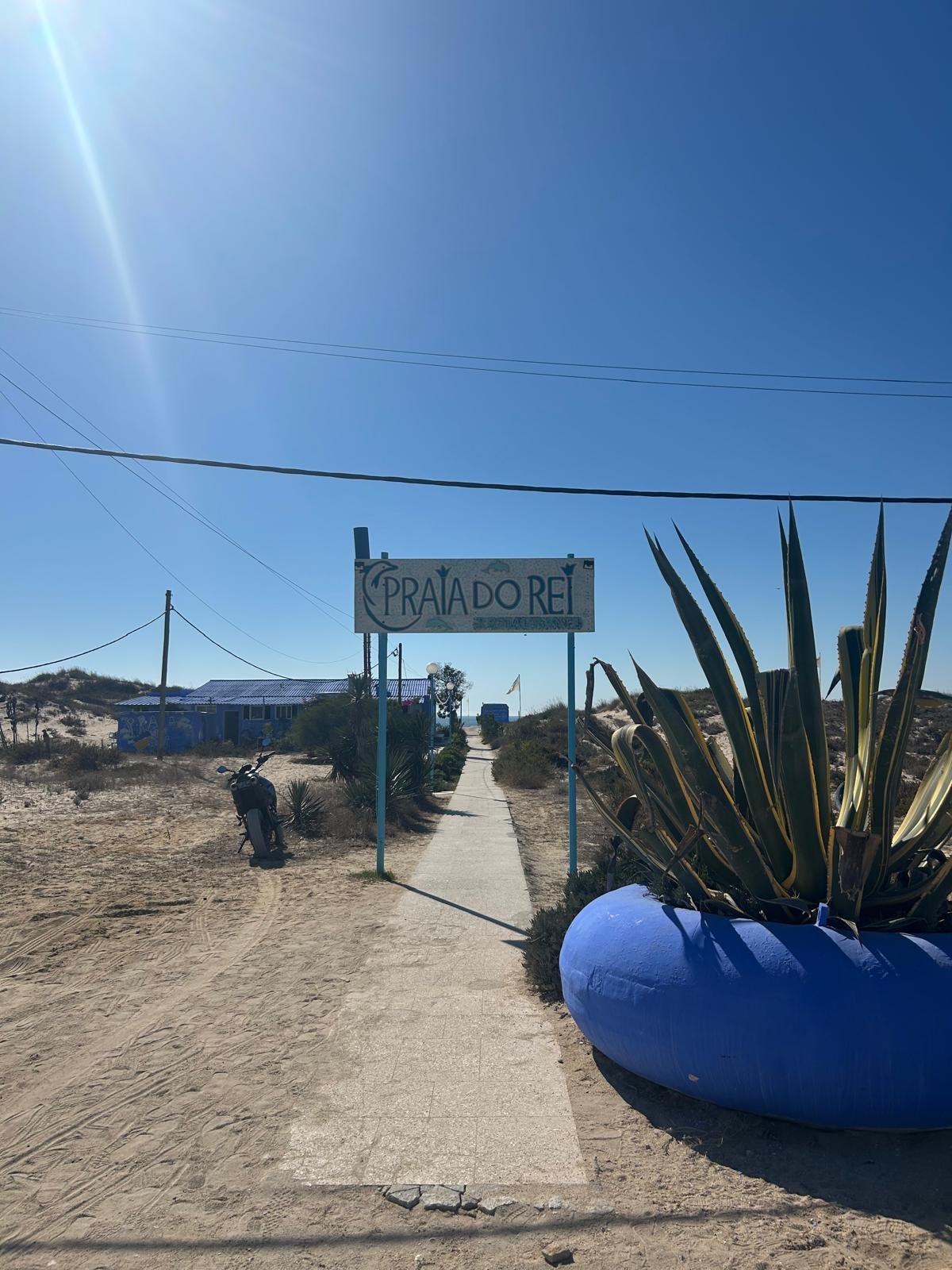 Beach entrance and sign at Praia do Rei